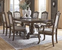 Generally the woods used for formal or traditional dining sets are mahogany and walnut. Charmond Dining Table And 6 Chairs D803 D6 01 4 01a 2 Dining Room Groups Price Busters Furniture