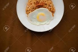 Indomie will be at almost every party giving delicious recipes with its food truck career events news promotions after over 1,000 entries, 10 winners emerge from crosspoint innovate 2021! Tasty Fried Noodle Indomie Goreng With Sunny Side Up Egg And Vegetable Served On White Plate Top View Close Up Detail Stock Photo Picture And Royalty Free Image Image 128567199