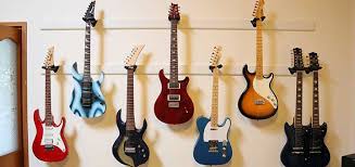 Guitar hanger has two keyholes on the back for easy hanging. Ultimate Diy Guide To Hanging A Guitar On The Wall Guitar Gear Finder