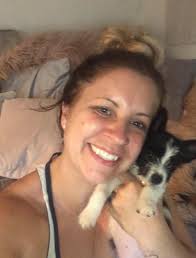 Dog comforting owner after ankle surgery