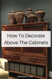 Add brick (or fake it with brick wallpaper!) above your cabinets for a cool, industrial effect. How To Decorate The Top Of A Cabinet And How Not To Designed