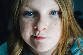 Girl, wind, eyes, closed, freckles, blonde by Candice Cason. Photo stock