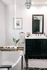 Combining white and gold speaks on a bathroom owner who wishes to create a clean and premium one. Black And White Bathroom Wall Decor Ideas Novocom Top
