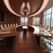 In The Conference Room Of The Santo Stefano Cooperative Credit Bank In Venice The Custom Aura Ceiling Light Mirrors The Shape Of The Table Located In The Middl