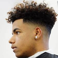 Many of the most popular hairstyles for a black man incorporate a fade haircut that's low, medium, or high, with styling on top. Pin On Black Men Haircuts