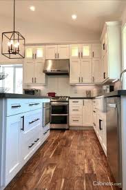 Black And White Cabinets Adding Warmth To A White Kitchen In 2020 Black White Kitchen White Shaker Kitchen White Cabinets