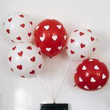 14,199 unique pictures of balloon. White And Red Balloons With Hearts On Them Hanging From Wooden Frame By Laura Stolfi Stocksy United