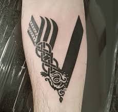 Right, let's get to it! 10 Awesome Vikings Tv Series Tattoo Designs Viral Tattoo World Vikings Is A Tv Series That Premiered In The Hi Tattoos For Guys Rib Tattoos For Guys V Tattoo