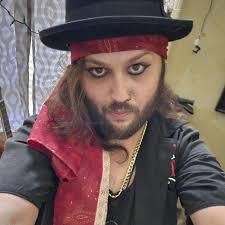 Heya, I don't normally post often, but I thought I'd share this photo of me  with my beloved, heavily modded p bass copy from last year with my last  band, Diablofurs. It