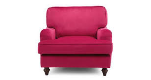 Alderney armchair in peony cotton matt velvet, georgette footstool in jade cotton matt velvet, lucy tiffney frond scatter cushion, house scatter cushion in the pink and turquoise velvet combination is striking and, whilst the styles are different, their more classic shapes complement one another. Jardim Armchair Sensual Velvet Dfs