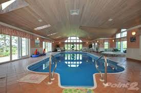 A tear in a swimming pool's lining, a protective layer applied to the pool before it's filled, is a common repair encountered by pool owners. 10 Houses With Swimming Pools For Sale In Canada Photos Point2 Homes