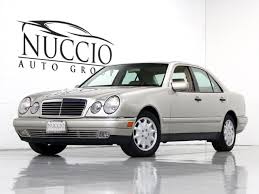 The floorplan features a bench seat with removable pedestal table and a mini kitchenette. 1999 Mercedes Benz E300 Turbo Diesel