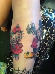 Hello kitty tattoo with the hair dryer and scissors but no music notes and she'd be wearing a frilly little apron. 10 Celebrity Hello Kitty Tattoos Steal Her Style