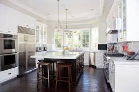 kitchen white cabinets dark floors