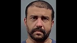 Report: Pensacola man took photos of another man over bathroom stall