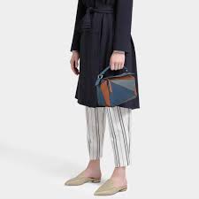 * expertly crafted from classic calfskin. Loewe Puzzle Small Bag In Steel Blue And Tan Calfskin Lyst