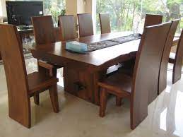 The intricately carved base highlights the wood natural grain. Take A Look And Get Inspired By Some Unique Wooden Dining Tables Moderndiningtables D Solid Wood Dining Room Solid Wood Kitchen Table Wood Dining Room Table