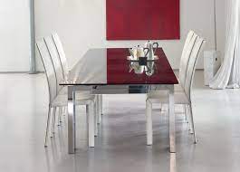 Extending dining tables are that kind of space saving furniture pieces that are ideal for families with smaller dining room area. Bonaldo Tom Extending Dining Table Modern Extending Dining Tables
