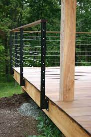 It is also durable where you don't have to spend much money to maintain it. Modern Cabin Deck Railing Metal Railing Posts Wire Wood Deck Railing Design Building A Deck Diy Deck