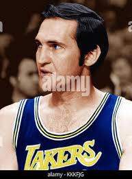 The Los Angeles Lakers' Jerry West moves the ball around Jim Washington and Bob  Boozer, right, to the Chicago Bulls during the March 26, 1968 game in the  Western Division NBA playoff