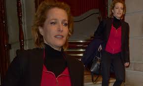 Gillian Anderson is typically stylish in a hot pink jacket and blazer combo  | Daily Mail Online