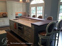 custom walnut wood raised kitchen bar