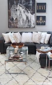 Coffee table with black leather sofa. Living Room Painting Black Leather Sofa White Cushion Sofa Carpet Coffee Table Candle B Rustic Glam Living Room Glam Living Room Contemporary Decor Living Room