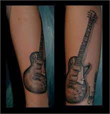 A tattoo design depicting the guitar and that too tribal style is something that can be really appealing. Les Paul Tattoo Guitar Tattoo Design Les Paul Guitars Guitar Tattoo