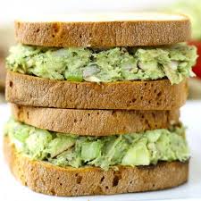 Two Healthy Tuna Sandwiches Stacked On Each Other Made With Avocado And Served On Whole Grain Bread Healthy Sandwiches Avocado Recipes Healthy Recipes
