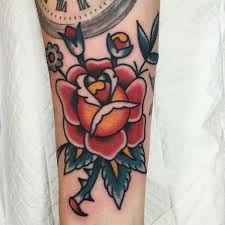Just as the names are contradictory, the logo is also the same, sporting two pistols and two roses. 155 Rose Tattoos Everything You Should Know With Meanings Wild Tattoo Art