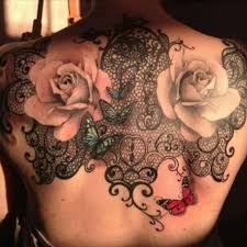 The tattoo artist has left enough space between the lines of the lace design to avoid the tattoo ink blending under the skin. Tattoo Uploaded By Katie Lace Rose Back Tattoo Lace Rose 87777 Tattoodo