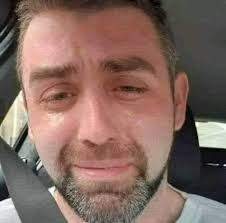 This is the final photograph of Phillip Herron 34, crying in his car,  literally minutes before taking his own life. He was a single Dad with  three kids, struggling with crushing debt