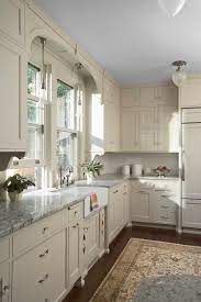 Though this kitchen's range and cabinets are both white, one has brass. Cream And White Kitchens Happy Accident Or Stroke Of Genius