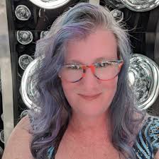 How to remove the stuck ribber arm from the Tru Knit machine?