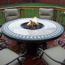 Many units have flat surfaces and trim that can act as table space to hold drinks and snacks. 60 Mosaic Round Fire Pit Table Fire Pit Table Round Fire Pit Table Gas Fire Pit Table