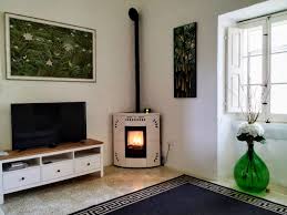 Pellet stove with soft and rounded lines, painted sheet metal lining, designed for installation in corners, making it ideal for. Heat Your Home Stylishly And Efficiently