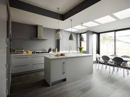 Ikea henriksdal bar stools sit at a carrera marble countertop accenting a dove gray island lit by vintage edison bulb lights hung over a sink with a brass gooseneck faucet. 25 Homely Gray Kitchen Cabinets For Cool Cooking Space