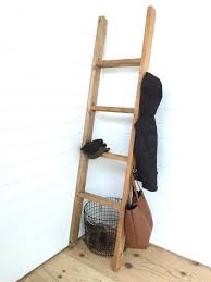 Add a flat black spray paint to give a modern industrial look this blanket ladder is a simple build made from wood dowels and copper tees and elbows. Blanket Ladder Ana White
