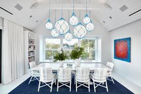 The perfect finishing touch to a vintage inspired living room or opulent dining room, this rectangular chandelier hangs from two adjustable chains, attached onto a simple dark metal frame. Zero