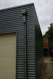 Arco metal roofing is a supplier of quality metal roofing and siding panels in the thumb area of michigan. Dark Brown Metal Siding Google Search Steel Siding Exterior Siding House Cladding