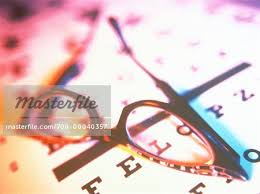 Close Up Of Eyeglasses On Eye Chart Stock Photo