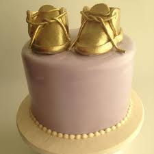 Unique, hand made baby shoes is a 2 piece gift set for your little bundle of joy. Gold Baby Booties Decorations