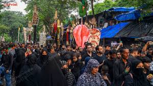 Shia Muslims take part in a Muharram ...