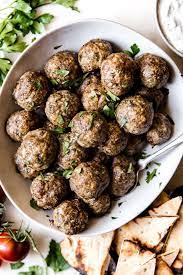 Mediterranean Meatballs With Tzatziki The Modern Proper Recipe Mediterranean Meatballs Mediterranean Cuisine Mediterranean Diet Recipes