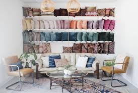 Rental Company Warehouse Showroom With A Pillow Wall And Neutral Leather Furniture Via Birch Brass Vintage Ren Furniture Showroom Furniture Leather Furniture