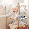 Crafted from manufactured wood, its two open shelves. 1