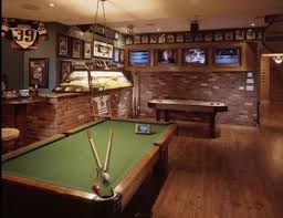 10 Must Have Items For The Ultimate Man Cave Man Cave Home Bar Man Cave Game Room Design