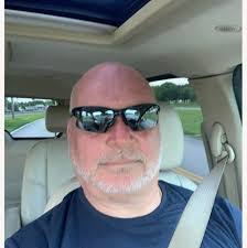 Who can cut coconuts from two trees in Pompano Beach at a reasonable price?