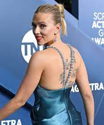 The screen beauty has a sunrise etched onto the inside of her left arm, but insists she will never reveal the special meaning of it. Scarlett Johansson Shows Off Her Massive Back Tattoo At Sag Awards Scarlett Johansson Hairstyle Scarlett Johansson Scarlett