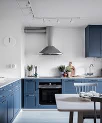A bespoke kitchen island, tone in tone with open shelving and built in wine storage. The Essential Scandinavian Decor Guide Kitchen Decor Trends Scandinavian Kitchen Scandinavian Kitchen Design